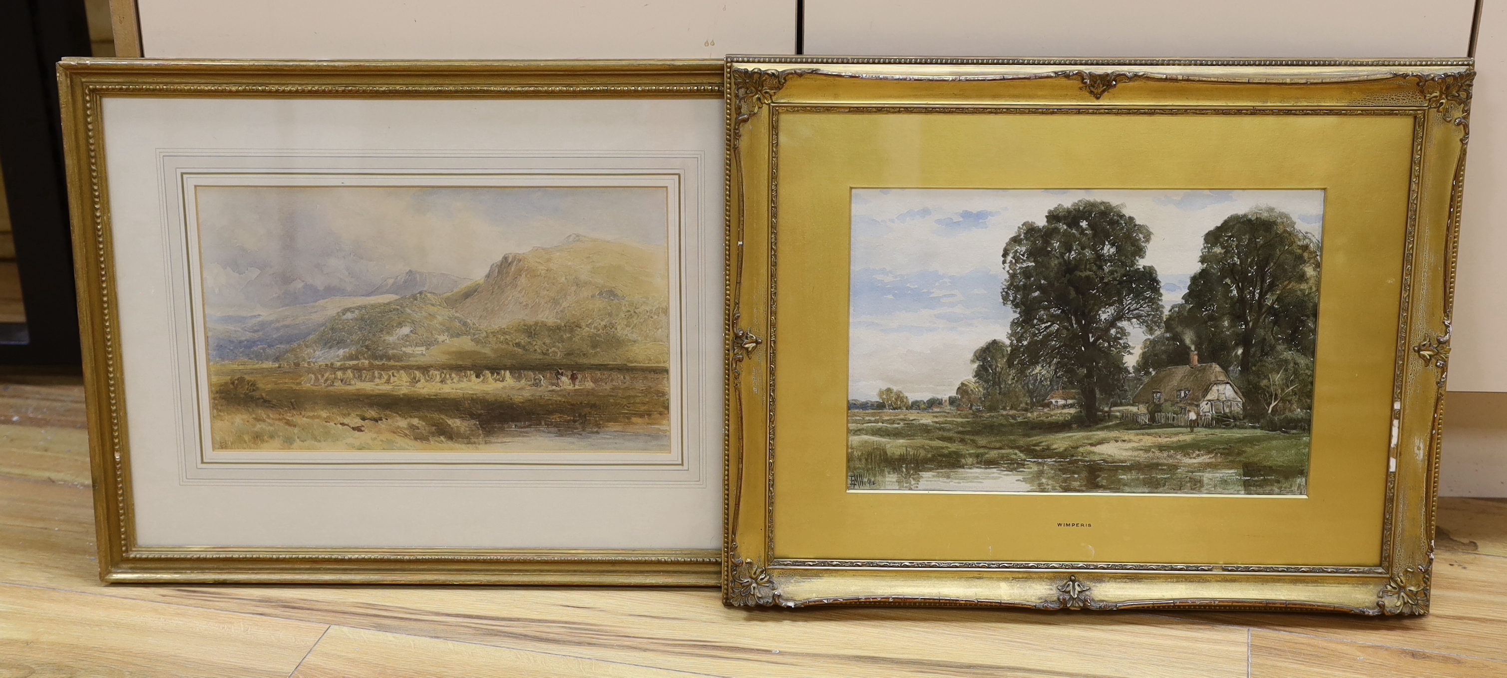 Edmund Morison Wimperis (1835-1900), two watercolours, Thatched cottages beside a pond, and Corn stooks in a landscape, both initialled, 24 x 35cm and 21 x 36cm, frames differ